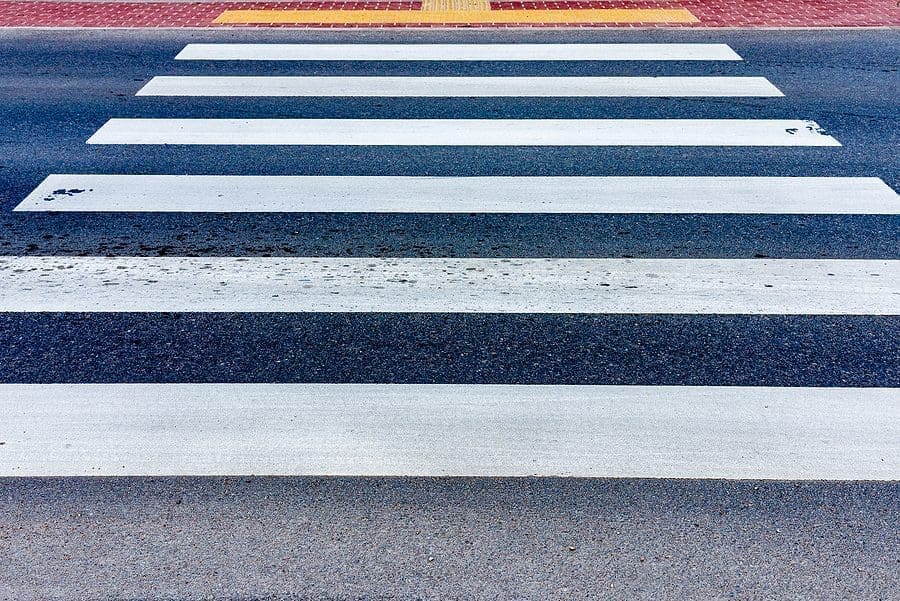 Crosswalk on the road for safety when people walking cross the street.