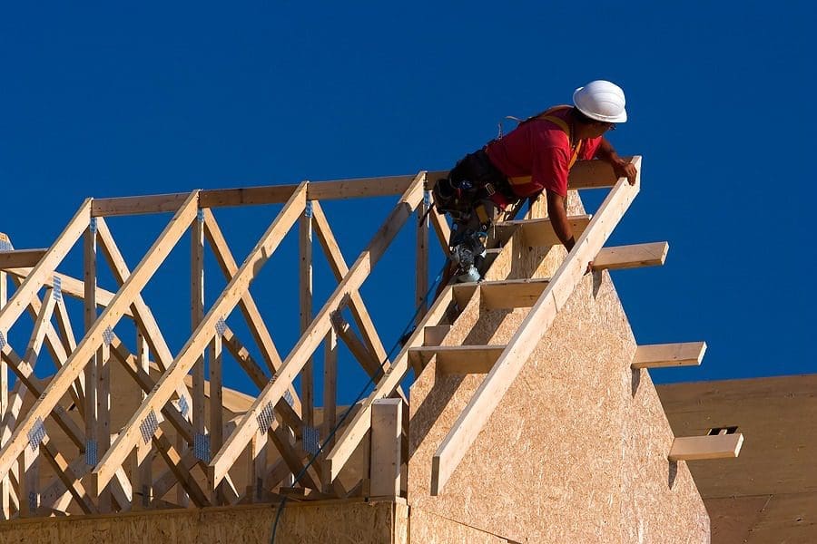 Woker constructing house