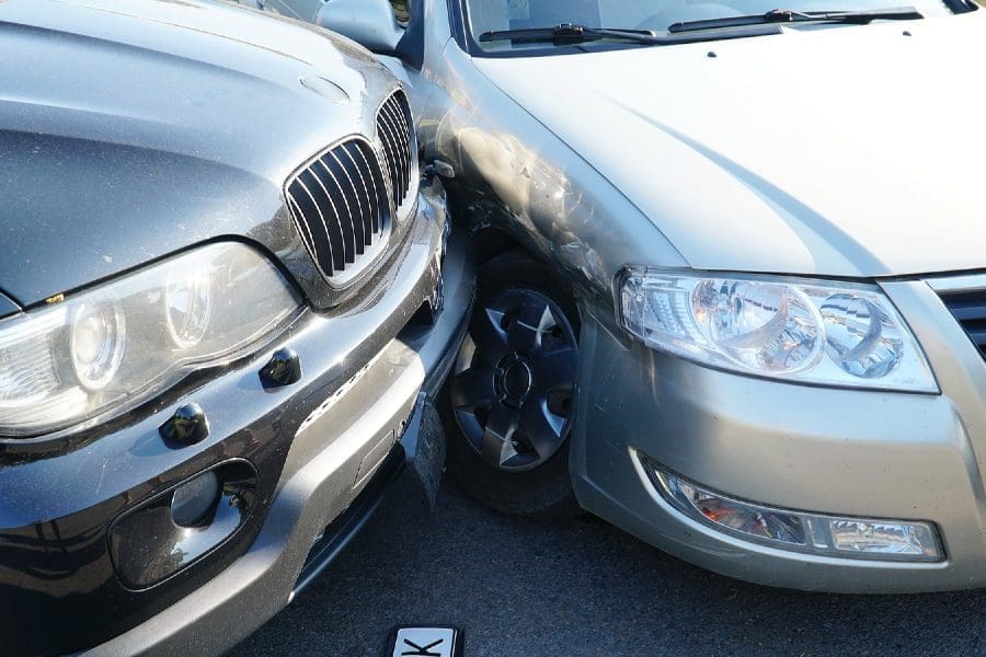 Broken rumpled dangerous car models after a severe accident with a skewed body, after a powerful blow.