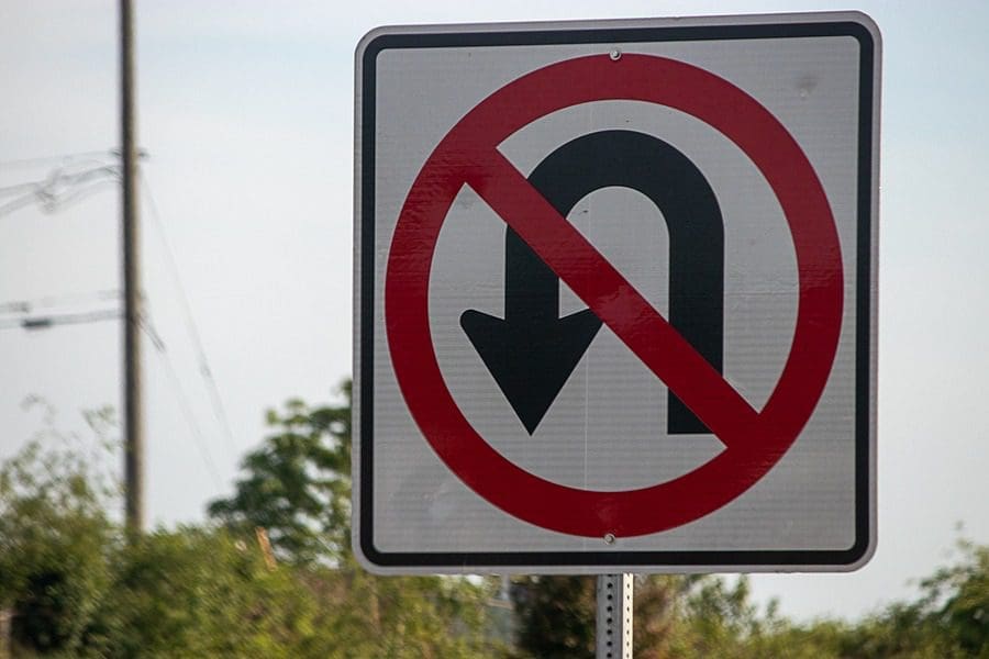 U-Turn Sign, driver making right on red has right of way