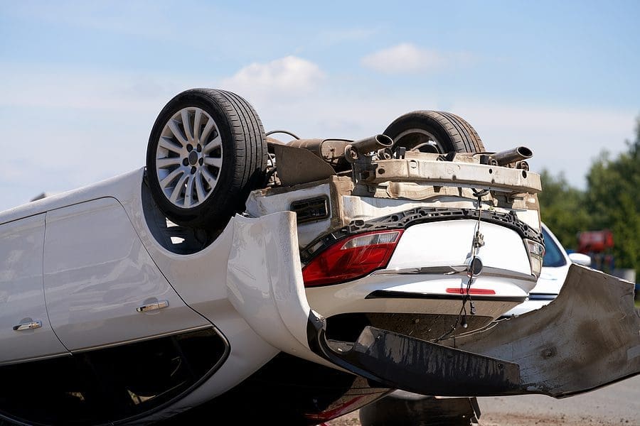 An Accident On The Road. A Close-up Of A Passenger Car Overturned