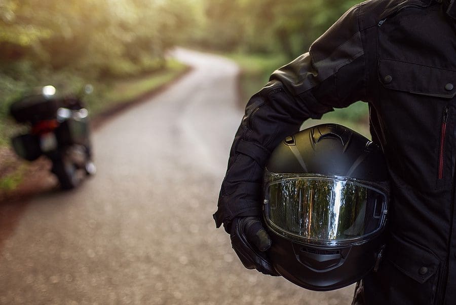 Man holding helmet