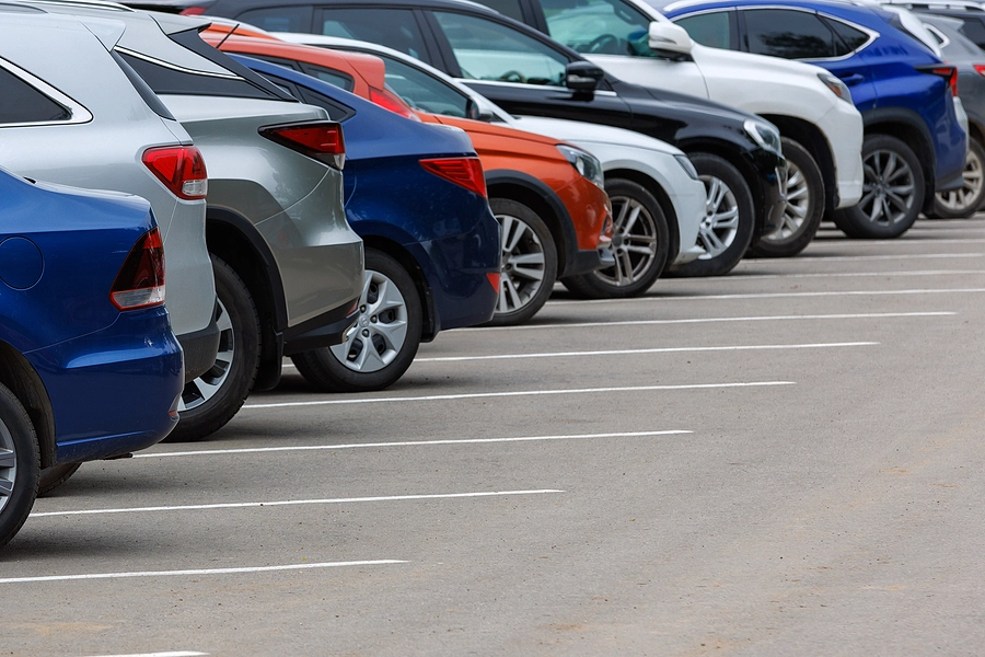 Line of different types of cars parked, some of which tend to cause more accidents than others